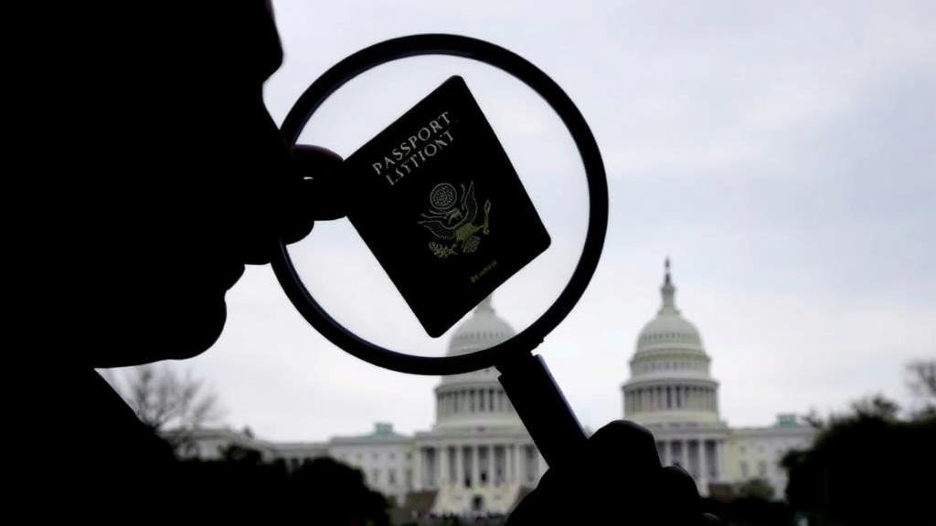 A symbolic representation of the vetting process for refugees, showing a silhouette of an individual holding a passport under a magnifying glass, with the US Capitol building in the background.